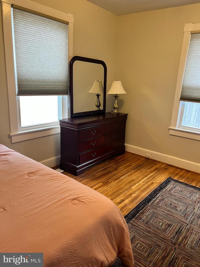 bedroom featuring dark wood-type flooring