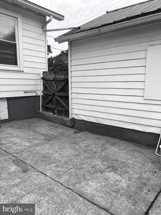 view of side of home featuring a patio area