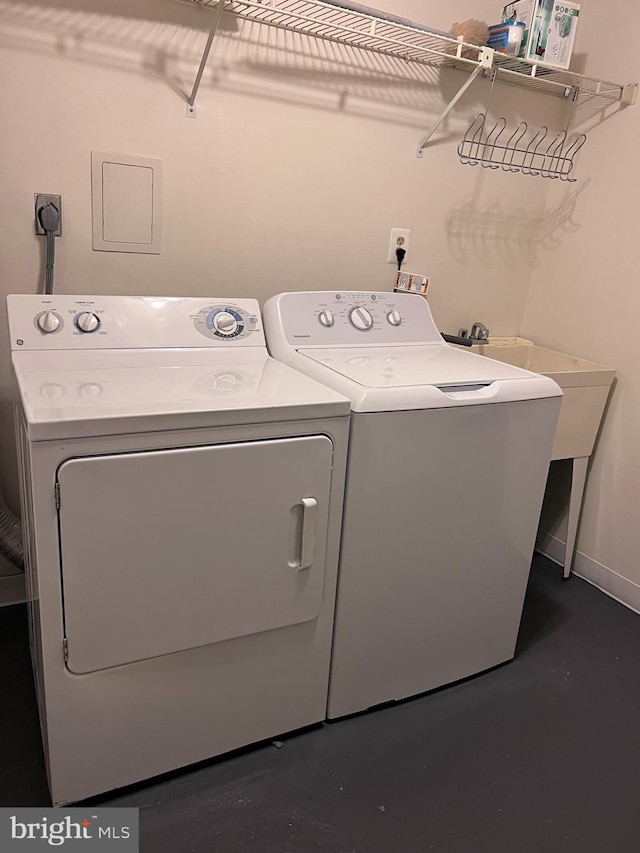 laundry room featuring washing machine and clothes dryer and electric dryer hookup