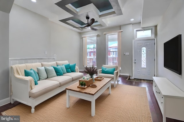 living room featuring hardwood / wood-style flooring, ceiling fan, and coffered ceiling