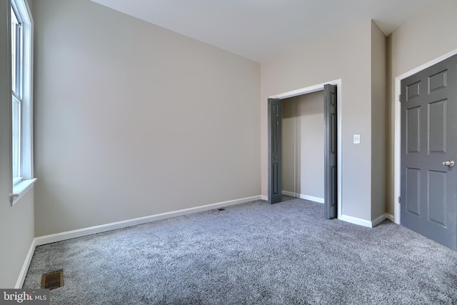 unfurnished bedroom with carpet floors