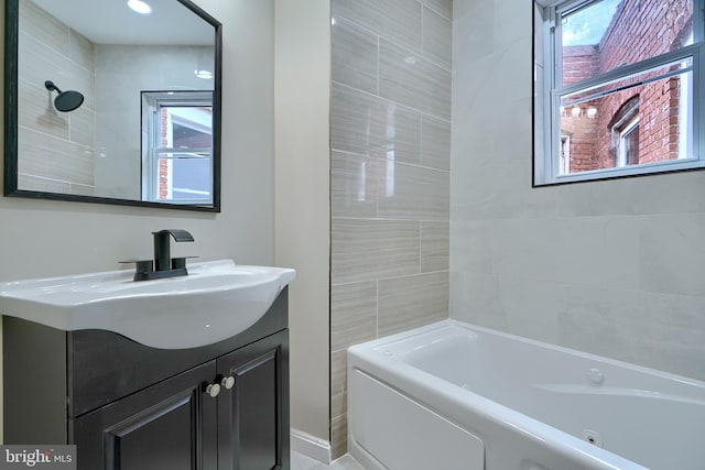 bathroom featuring vanity and tiled shower / bath combo