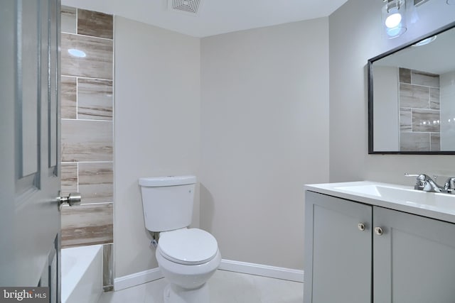 bathroom with tile patterned flooring, vanity, and toilet