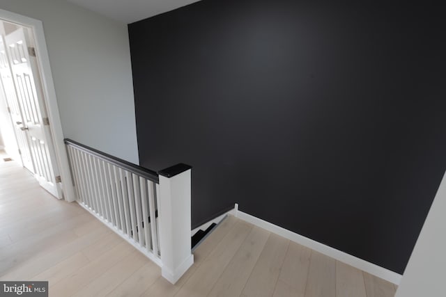 staircase featuring hardwood / wood-style floors