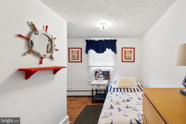 bedroom featuring a textured ceiling, a baseboard radiator, and dark hardwood / wood-style floors