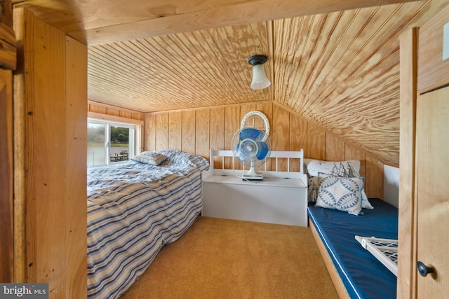 unfurnished bedroom featuring carpet flooring, lofted ceiling, wood ceiling, and wooden walls