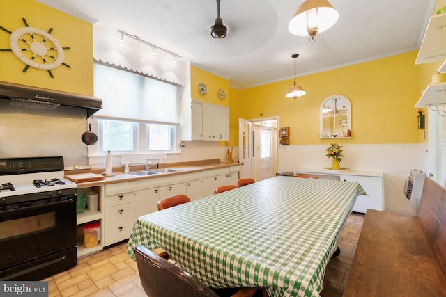 kitchen with ceiling fan, sink, hanging light fixtures, black electric range, and ornamental molding