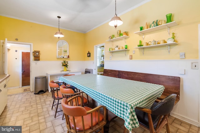 dining area with crown molding