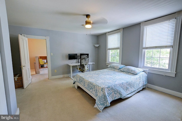 carpeted bedroom with ceiling fan