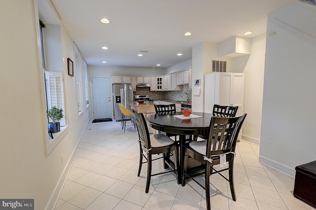 tiled dining space with sink