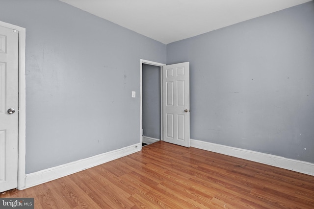 spare room featuring light hardwood / wood-style floors