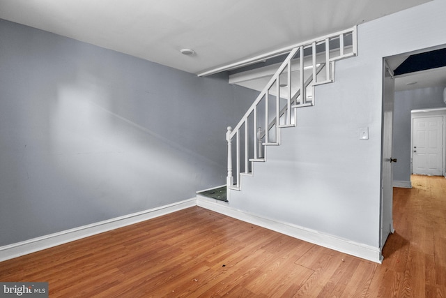 stairs with wood-type flooring