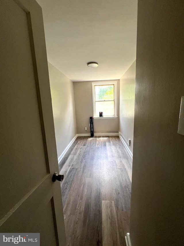 empty room with hardwood / wood-style flooring