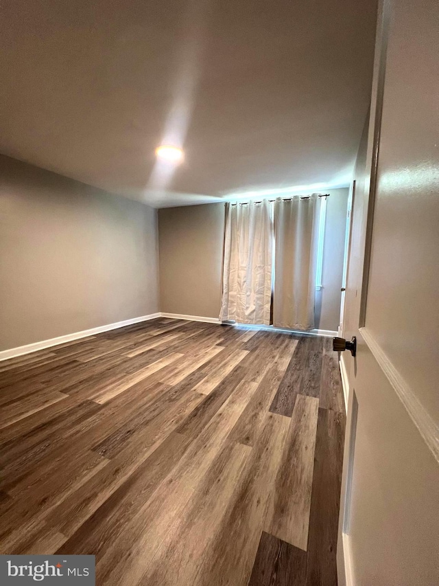 unfurnished room featuring hardwood / wood-style floors