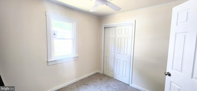 bathroom with ornamental molding and toilet