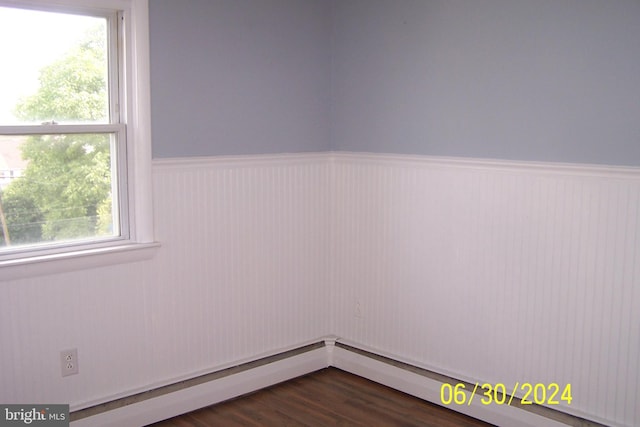 spare room featuring dark hardwood / wood-style flooring