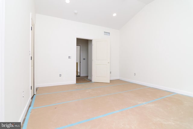 unfurnished bedroom featuring vaulted ceiling