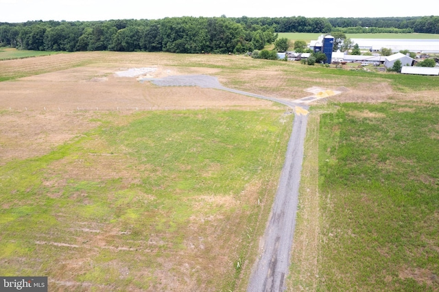 birds eye view of property with a water view and a rural view