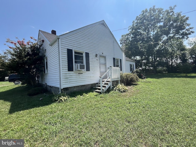 view of property exterior featuring a lawn