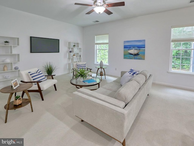 living room with ceiling fan and light carpet