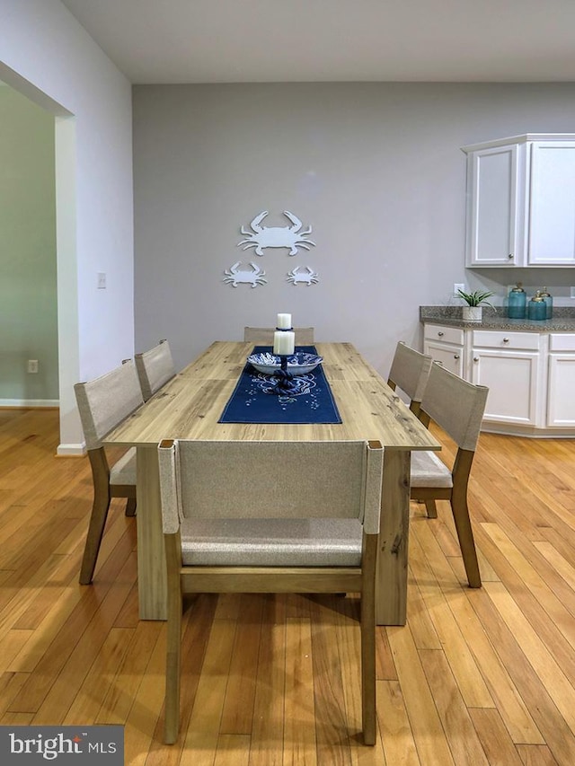 dining room with light hardwood / wood-style floors