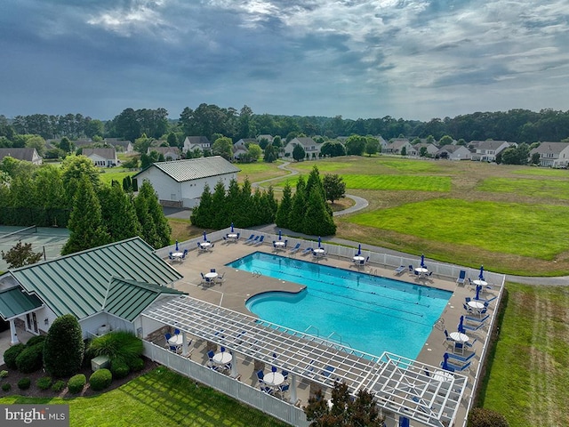 view of swimming pool featuring a patio area