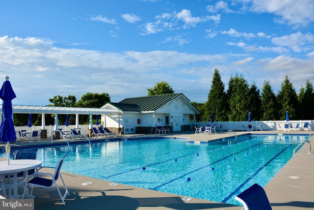 view of swimming pool with a patio area