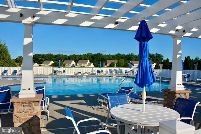 view of pool with a pergola and a patio area