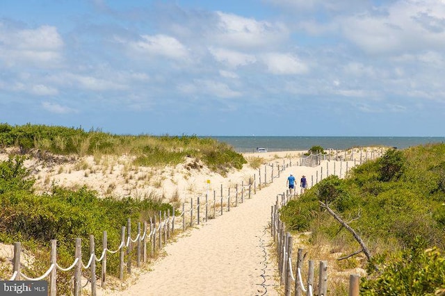 property view of water featuring a beach view