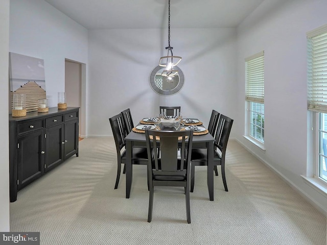 dining space with light carpet