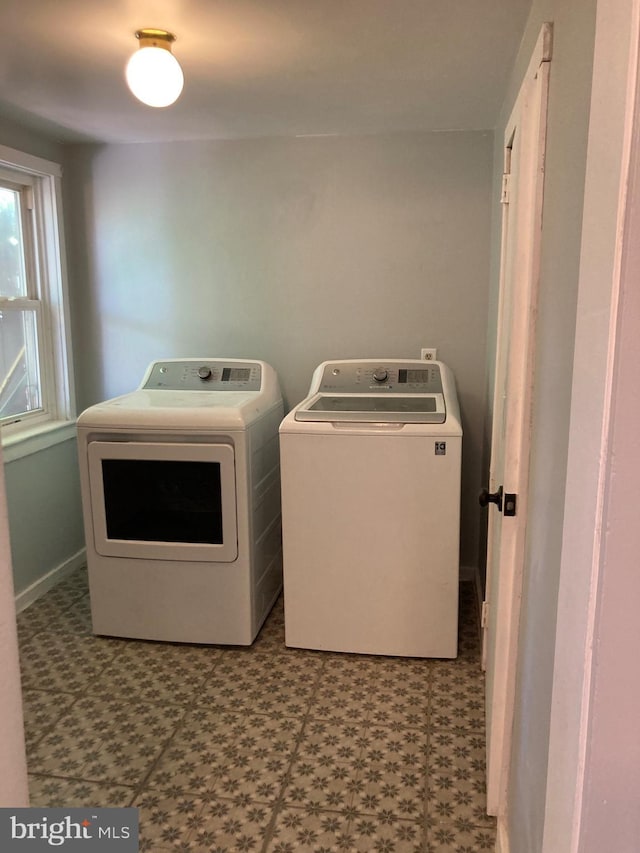 washroom with washer and dryer