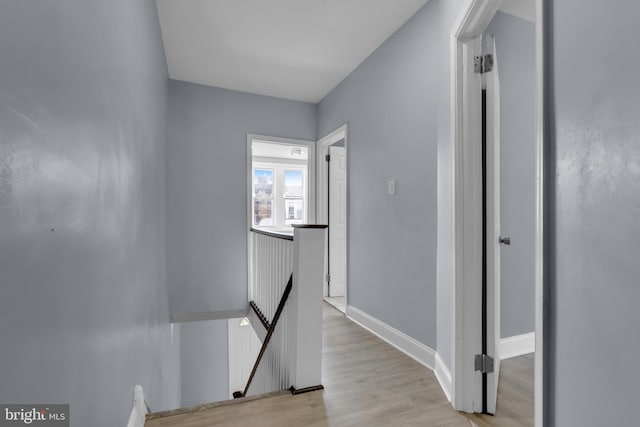 corridor with light wood-type flooring