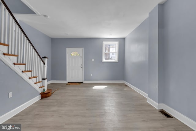 entryway with light hardwood / wood-style flooring