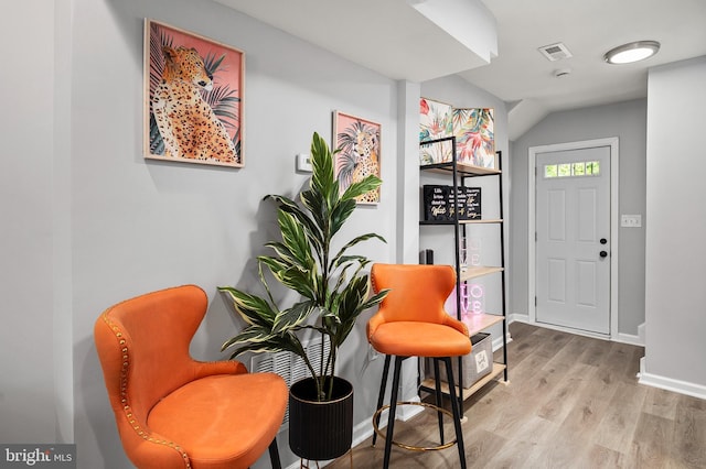 sitting room with light hardwood / wood-style flooring