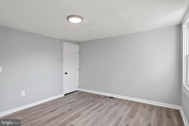 spare room featuring light hardwood / wood-style floors