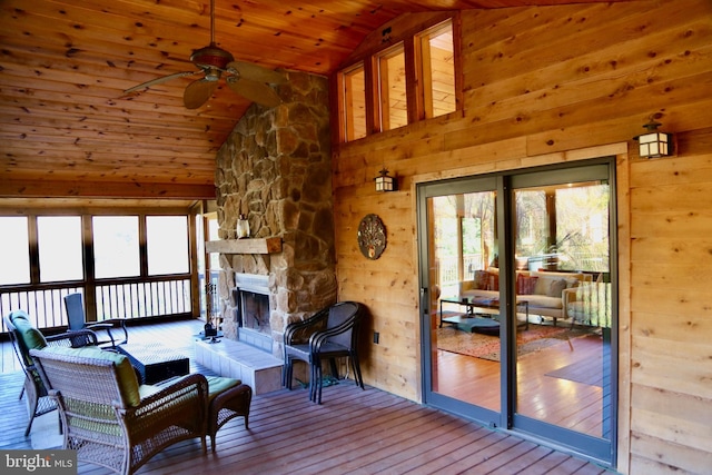 living room featuring hardwood / wood-style flooring, high vaulted ceiling, ceiling fan, and wood ceiling