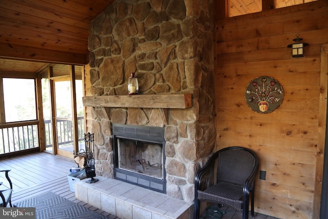 unfurnished living room featuring wooden walls, a fireplace, wood ceiling, and hardwood / wood-style flooring