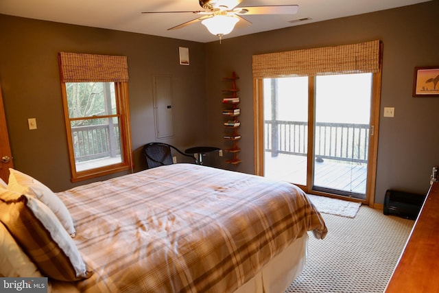 bedroom with access to outside, ceiling fan, and light colored carpet