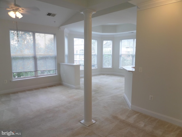 spare room with ceiling fan, light colored carpet, and ornate columns