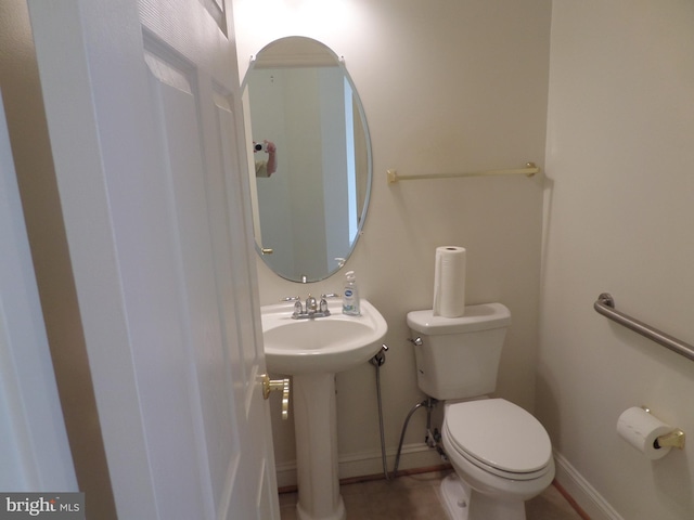 bathroom with tile patterned flooring and toilet