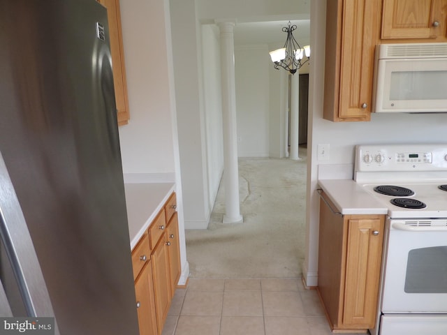 kitchen featuring hanging light fixtures, white appliances, an inviting chandelier, decorative columns, and light colored carpet