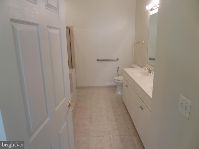 bathroom featuring vanity, toilet, and tile patterned floors