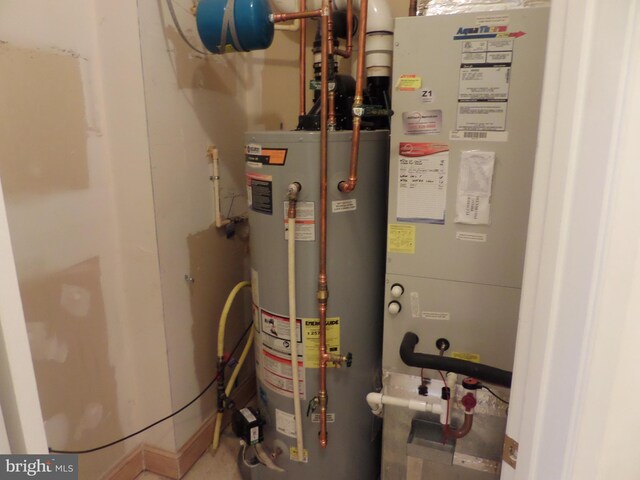 utility room featuring gas water heater