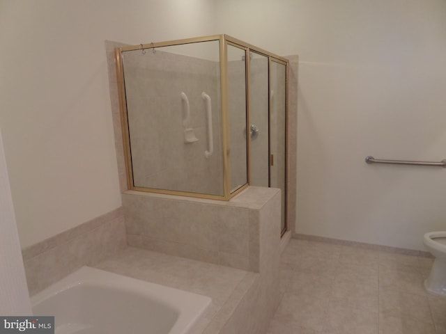 bathroom with toilet, plus walk in shower, and tile patterned flooring