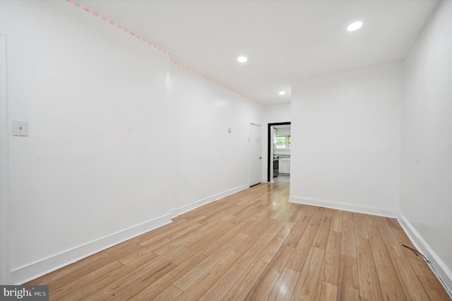 spare room featuring light hardwood / wood-style flooring