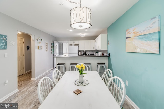 dining area featuring light hardwood / wood-style flooring