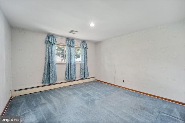 carpeted empty room with baseboard heating