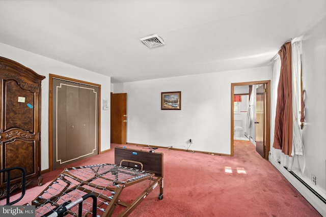 carpeted bedroom with a baseboard radiator, ensuite bath, and a closet