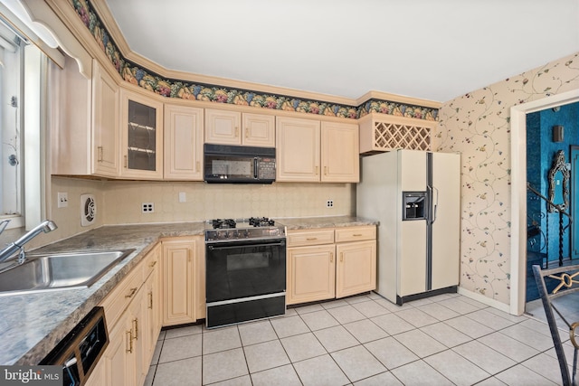 kitchen with sink, backsplash, light tile patterned flooring, black appliances, and ornamental molding