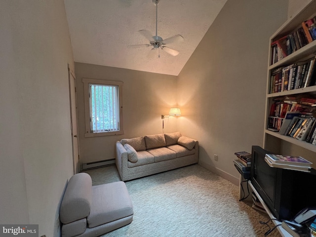 interior space featuring a textured ceiling, light colored carpet, ceiling fan, a baseboard heating unit, and lofted ceiling